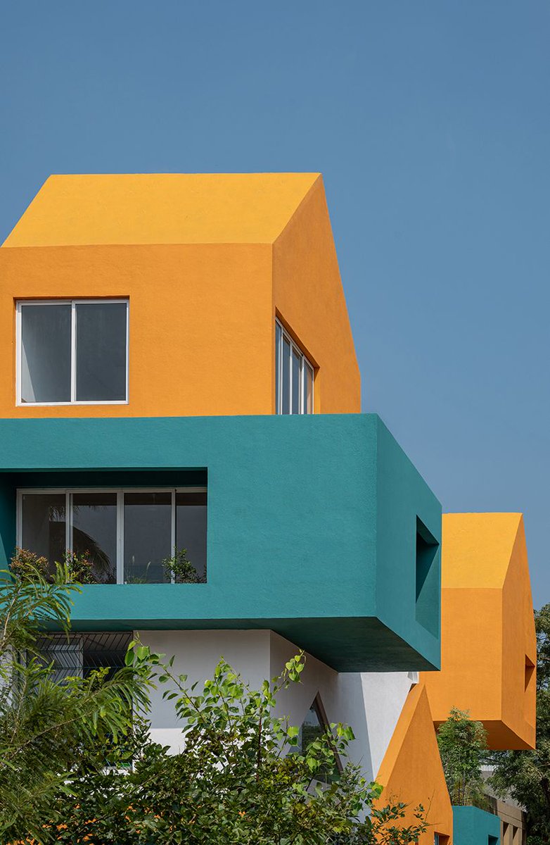 projected cantilevers and recessed windows in vibrant hues compose sanskruti school in india buff.ly/49Qo67a