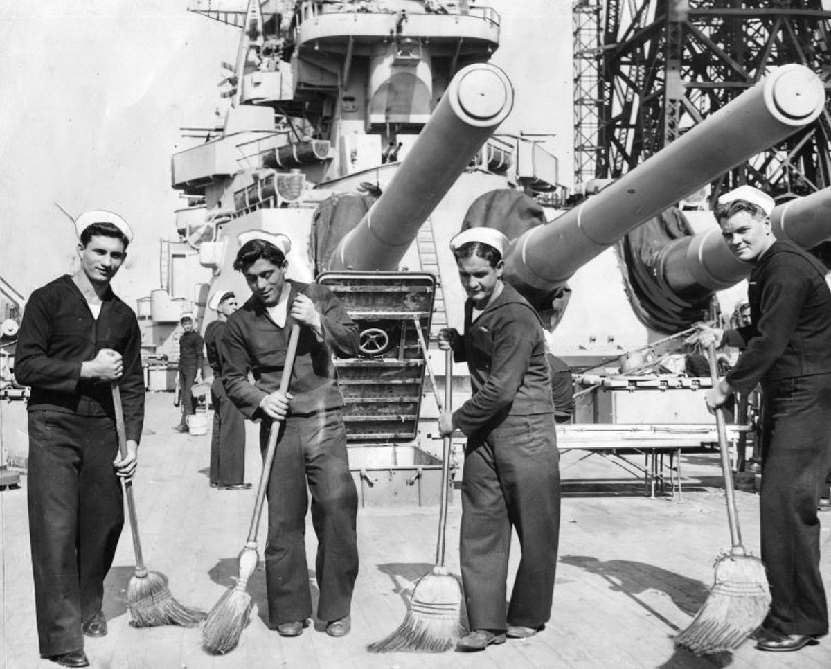 Philadelphia men sweeping the main deck of USS Washington (BB 56) while she’s at Philly NY prepping for Op Magic Carpet to England. October 18, 1945 (Left to right) Joseph Galante, Nick Lademarco, Andrew Oberton, John Hagerty George D. McDowell Collection #BB56 #USSWashington