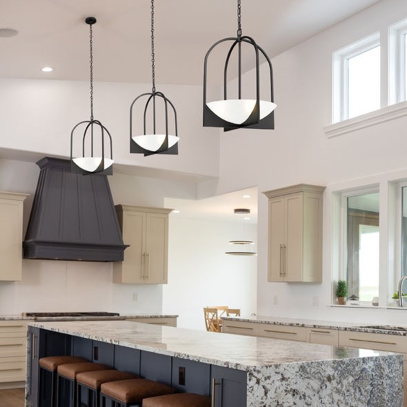 A sand-blast matte black finish offers a stylish touch to this pendant light with an artisan aesthetics. An elliptical frame contains a waterglass bowl acting as a diffuser that creates a soft light for foyers, dining, bedrooms, and hallways. #pendantlighting #sundiallighting