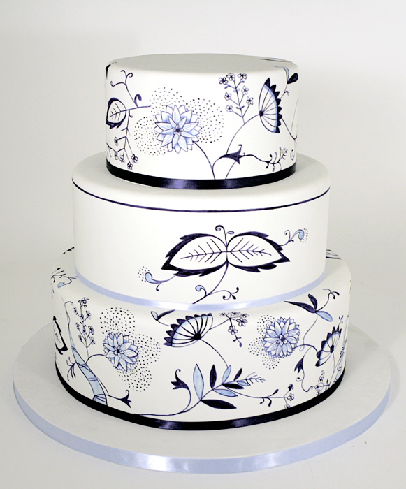 Spring is here! And we love painted botanical cakes. This tiered cake has clean lines stylized imagery. #paintedcake #tieredcake #customcake #aceofcake #charmcitycakes #floral #botanical #ccc
