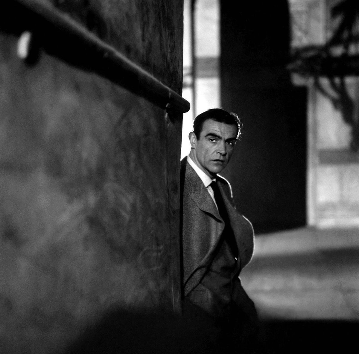 BondinColour's tweet photo. Sean Connery at the Hagia Sophia, Istanbul, Turkey during filming for From Russia With Love. What’s interesting here for style folks is that he appears to be wearing a coat over his suit, something we don’t see in the film. #bond #jamesbond #seanconnery #frwl  #colourised https://t.co/CUAJS0g3jL