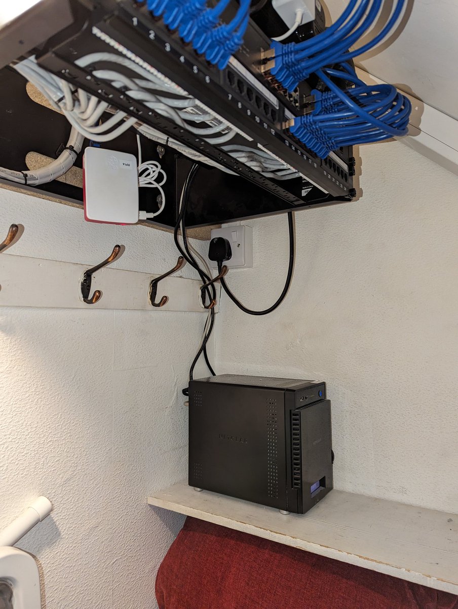 The last resident of the comms cabinet moves in. This is the Raspberry Pi 4 that streams the Feeder and Fox video to YouTube so the livestream will be back up shortly. The server and the NVR are in there too. We also have one of the NASs in here under the stairs out of the way.