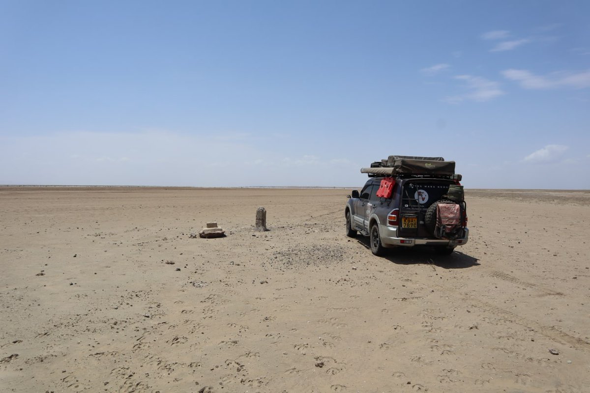 That short concrete pillar is an international boundary beacon. Just in front of the pillar is Ethiopia, while the car is standing on Kenya territory. If you love absolute solitude, then you would have been very happy here. Total solitude. Almost.