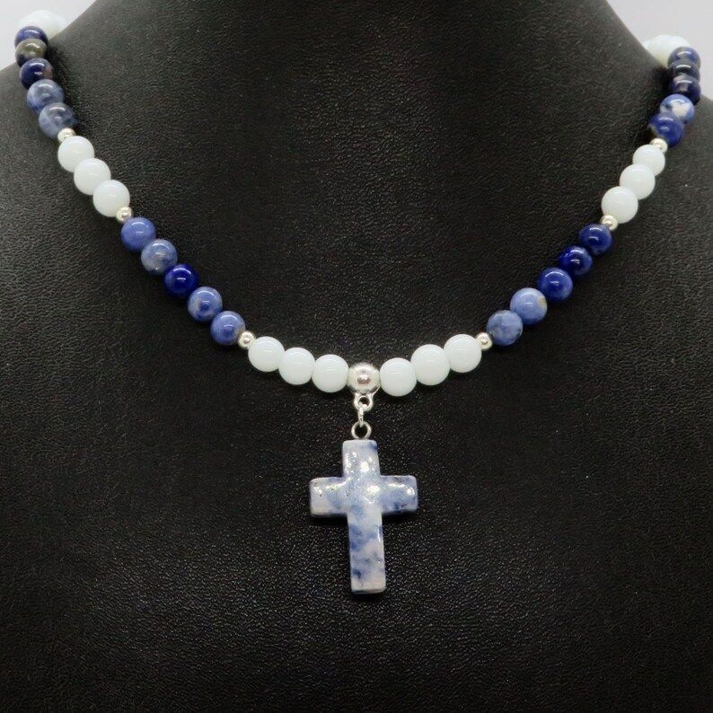 Sodalite & White Jade Cross Pendant with Isaiah 41:10-13. Embrace strength in faith. Fear not with this unique piece from RivendellRocksSedona. #ChristianJewelry #GemstoneNecklace buff.ly/47YTobz