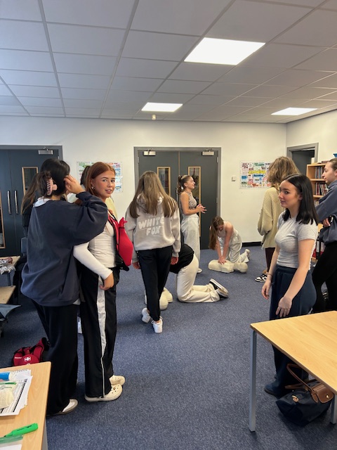 Year 13 Health and Social Care students enjoying a first aid session with Mr Abrahams.