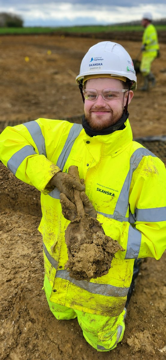 Check out this stunning Roman hand shovel! It looks just like the ones we use every day on National Highways @A428Cat (as modelled by Archaeologist Solomon) The Romans used these as fire shovels 🔥 We found it in an area with evidence of industry, including lots of charcoal!