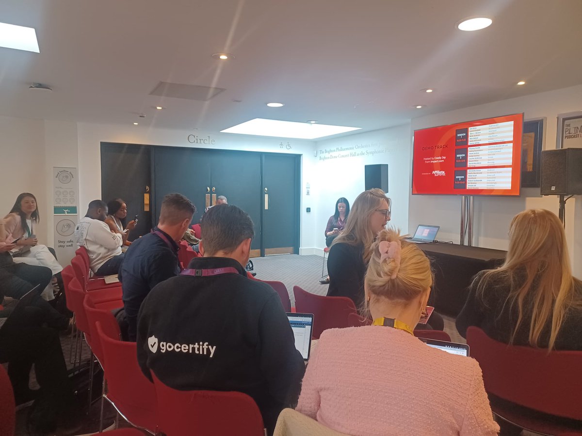 AffiliateHuddle's tweet photo. Also happening NOW is round 3 of the Demo Track. Eight more speakers have 5 minutes each to talk about their products or tech, and convince the judges to send them to @affiliatesummit West. 

@impactdotcom's Coady is ready to cut them off if they go over time. #AffiliateHuddle https://t.co/h3mo0D0KZ5