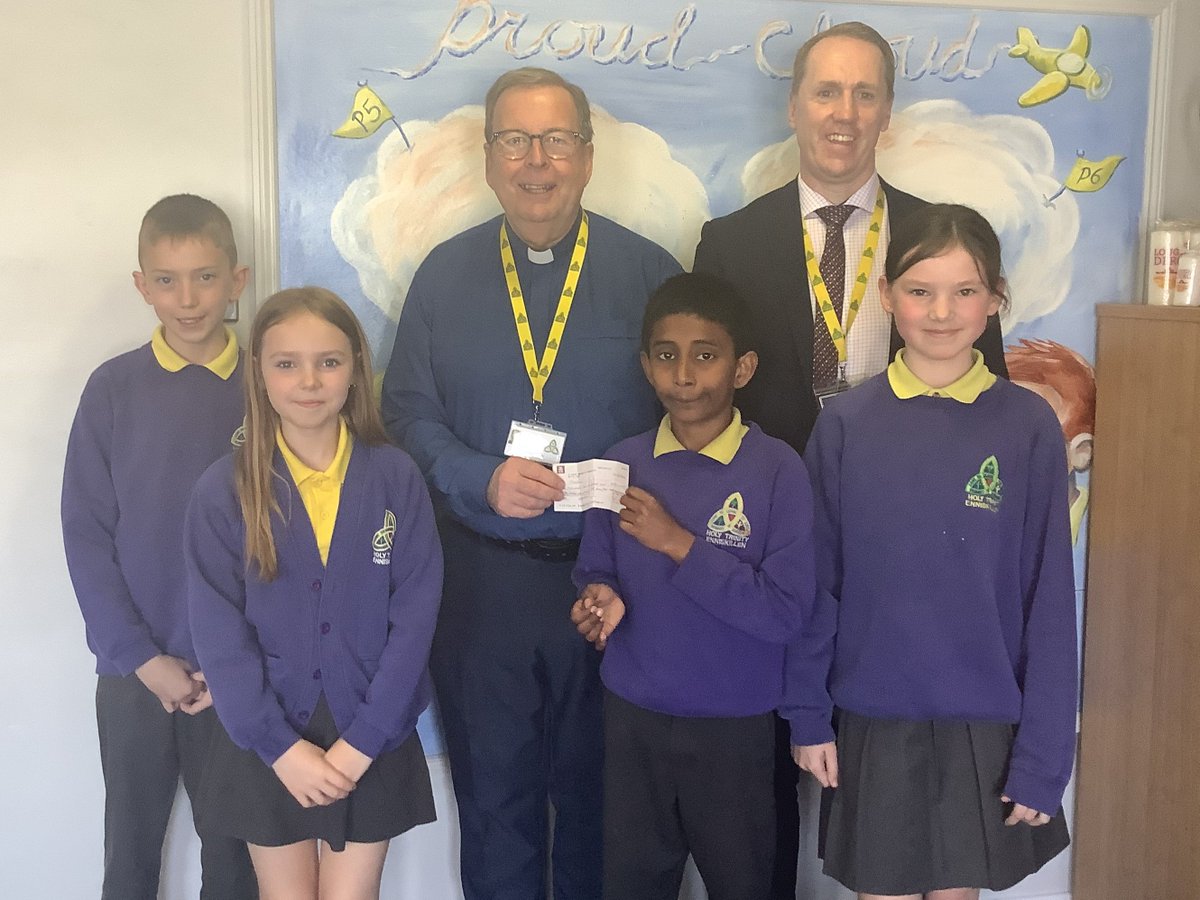 Mr Treacy and some of our KS2 pupils present Deacon Martin with a cheque for Trócaire. The money was raised by classes accross our school during the run up to Easter. There was a fantastic response from our families and in total our school raised a fantastic £1,359.85. 👏