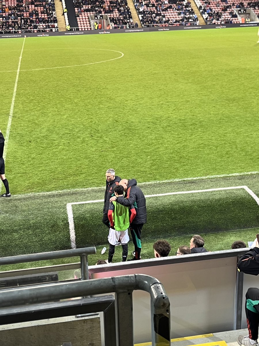 Shea Lacey now receiving instructions from Adam Lawrence ahead of a substitution.