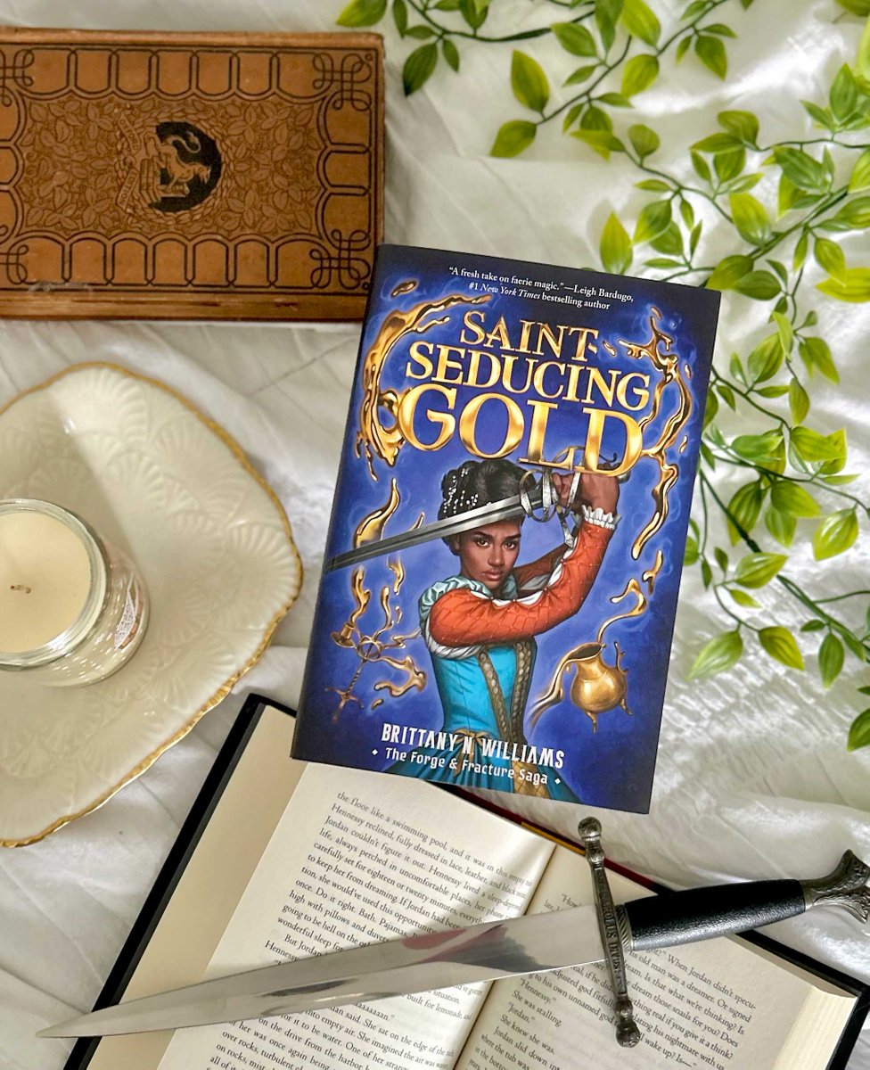 She’d kill to save what she loved, and not regret it. Not any of it. #SaintSeducingGold, the latest book in @brittanyacts's Forge & Fracture Saga, is finally here! Get your copy today to dive into this epic fantasy. #BookBirthday bit.ly/3Ilq4S1