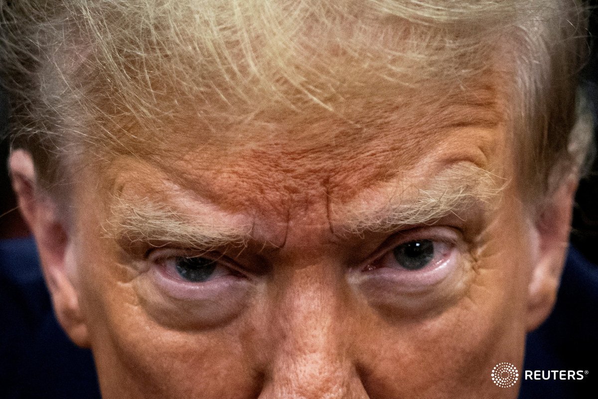 Former President Donald Trump waits for the start of proceedings in Manhattan criminal court. Pool photo by Yuki Iwamura