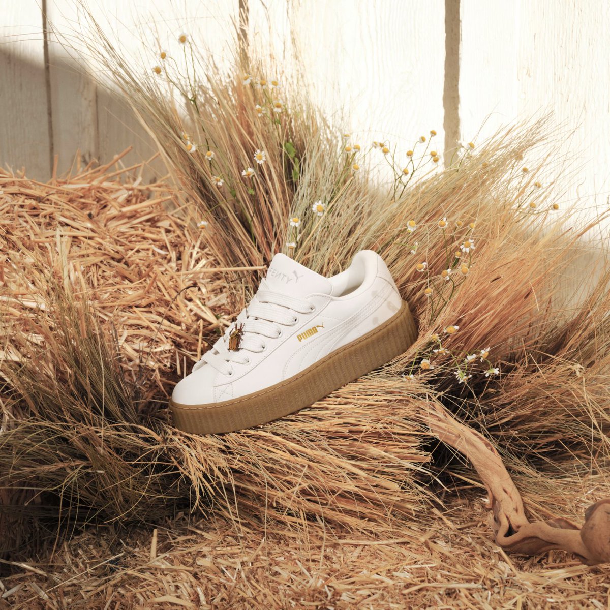 It’s all in the details. This new Creeper Phatty stands out with luxe, premium nubuck and touches of gold. The FENTY x PUMA Creeper Phatty Earth Tone will be available in women's and kids sizing on April 25th at Foot Locker.
