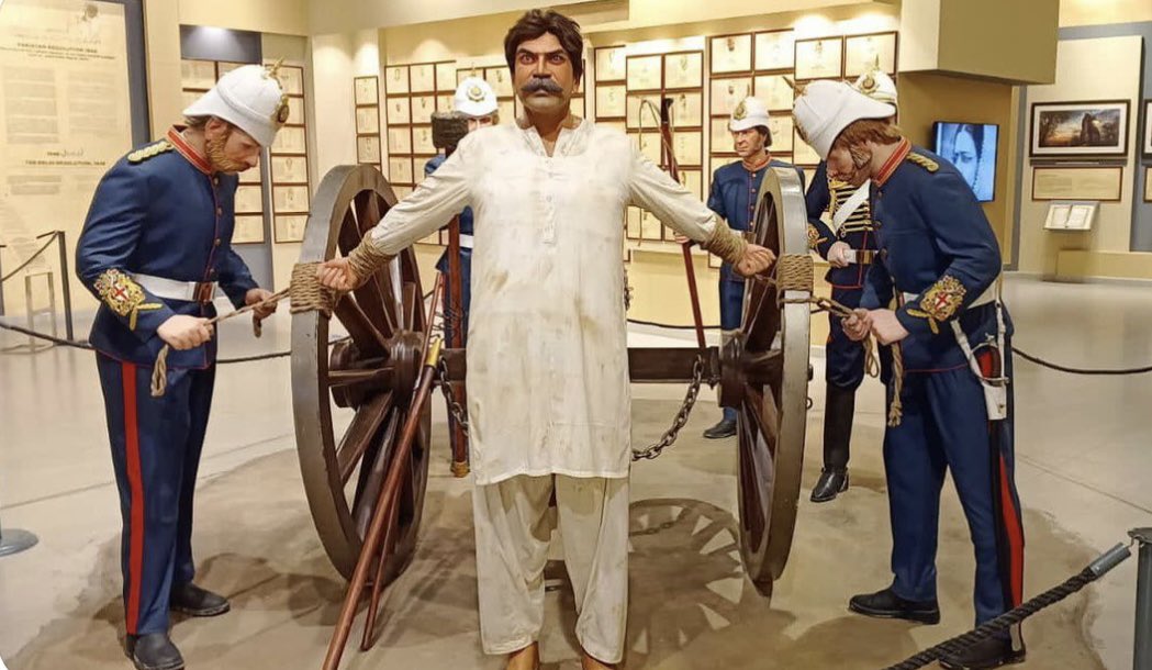 This image, taken from an exhibit at the history museum of Lahore, depicts an Indian man being tied for execution by cannon by British Empire soldiers.

This method of execution is primarily associated with the British East India Company's rule in India. 

After the Indian