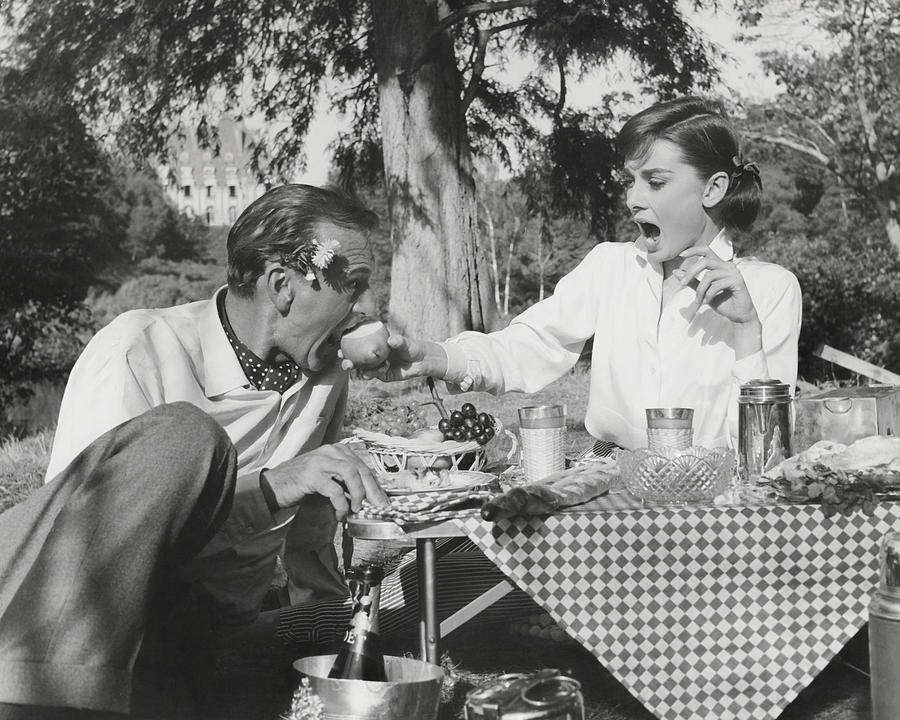Audrey Hepburn and Gary Cooper photographed during the filming of Love in the Afternoon, 1957