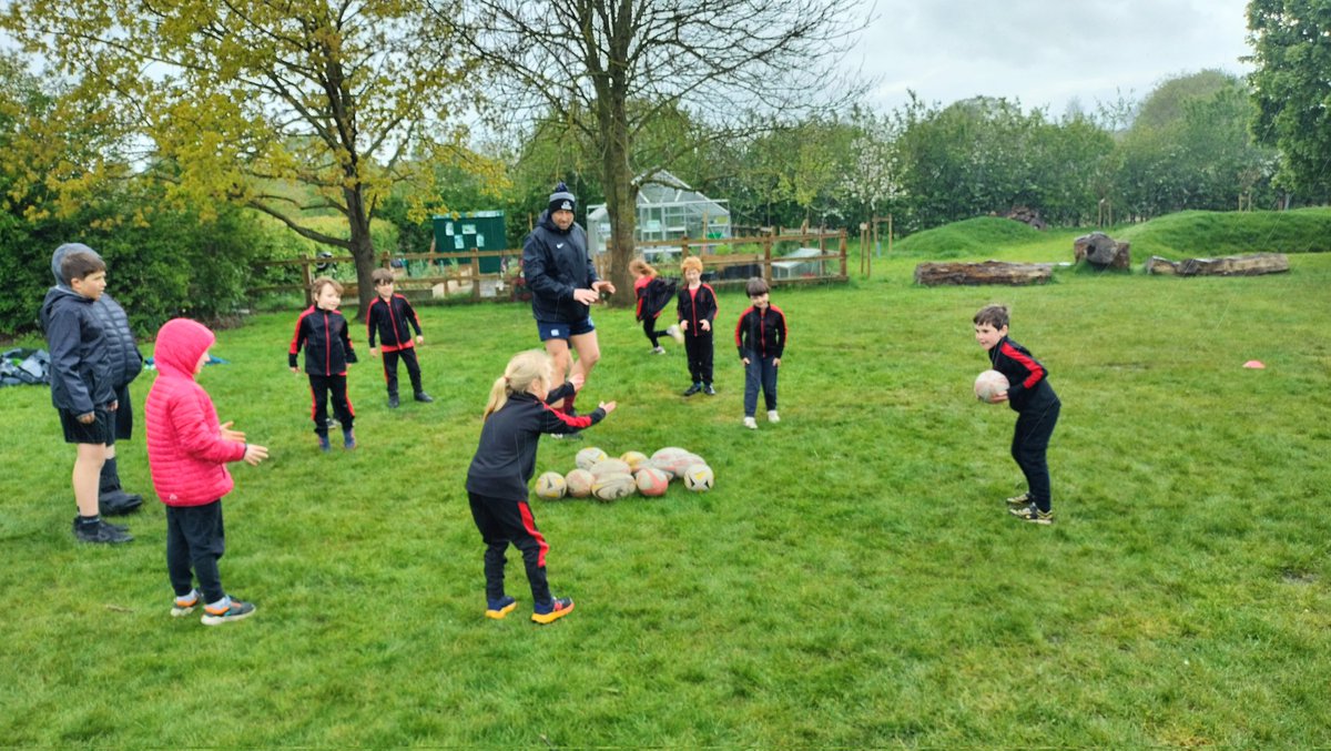 KS1 After school Rugby Club got underway in the rain today! That won't stop us. Smiles, energy and mud- a fabulous hour learning new skills. Great support from our school community to share expertise #community