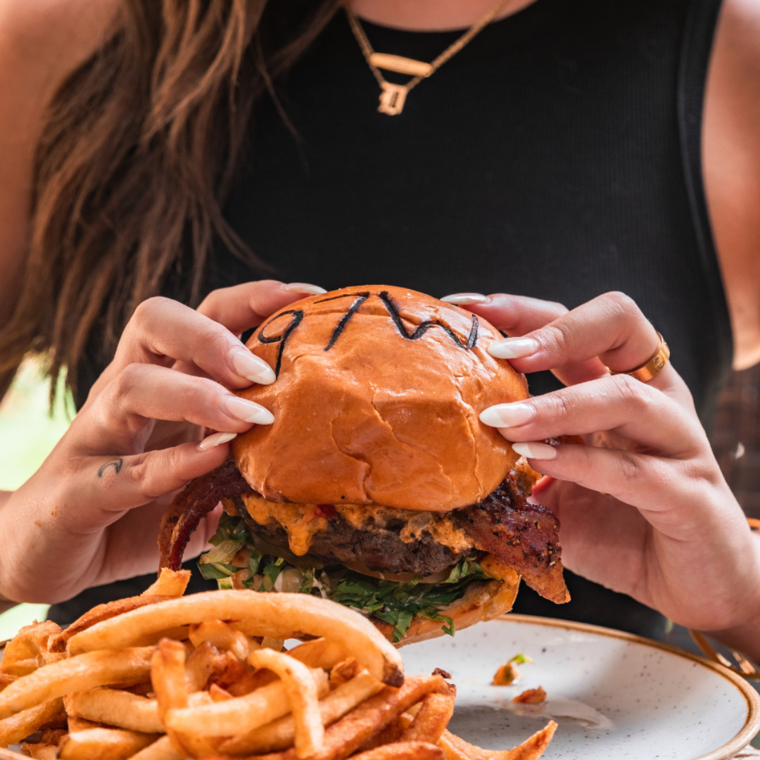 Sink your teeth into deliciousness at 97 West Kitchen &amp; Bar! 🍔 For the ultimate spring vibes, dine outside and enjoy the sunshine with one of their signature smokin' margs! 🌞🍹🌶️ 

97westkitchenandbar.com