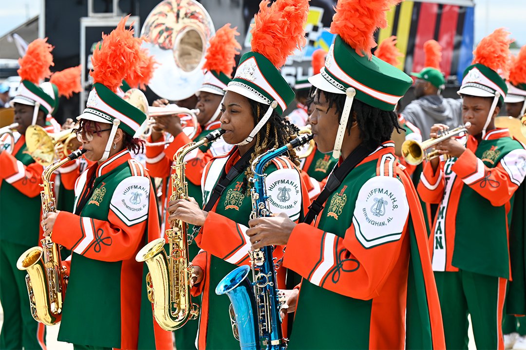 This is how we do #DEGA. The @HHSViks Marching band represented #BCS Sunday at @NASCAR'S #GEICO500. The scholar musicians and auxiliary teams turned up the music and the fancy moves as fans entered the track. Shout out to everyone who made it happen for our students.