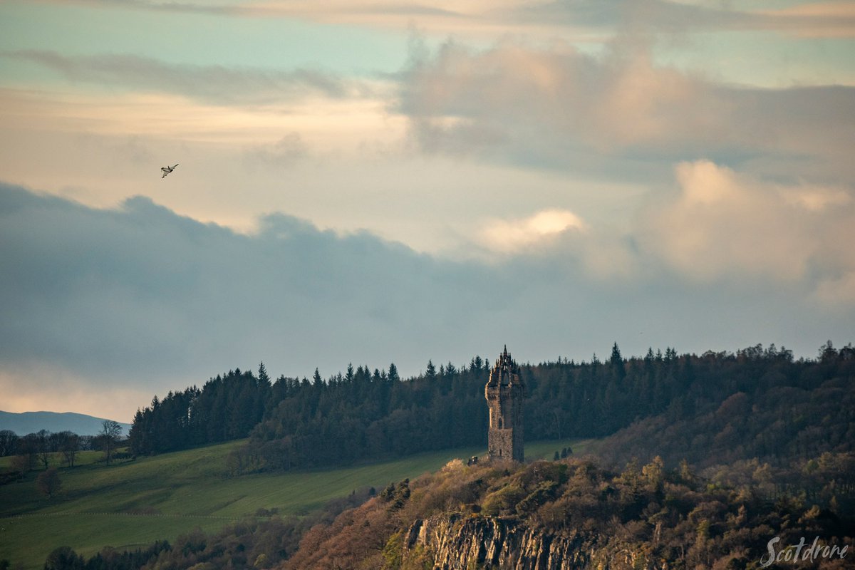 Is it a bird, is it a plane? 🛩️ @scotdrone managed to capture this photo of a Typhoon jet flying past the Monument a few weeks ago 📸. #VisitScotland
