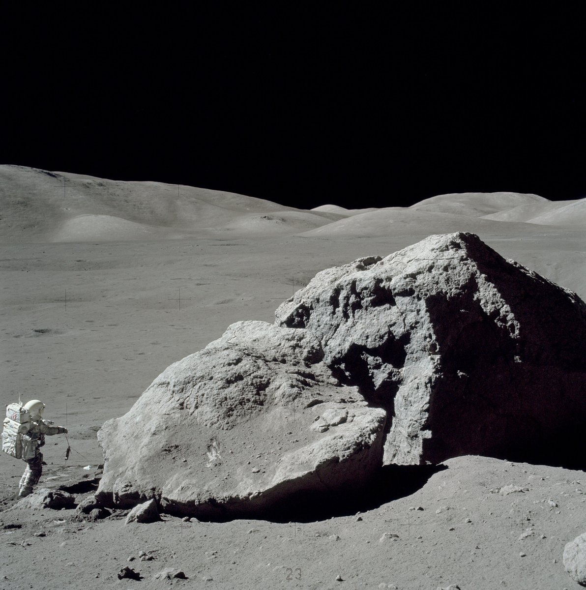 Astronaut Harrison H. Schmitt stands adjacent to a massive, fractured rock during his third moonwalk on the Apollo 17 mission. (Credit: NASA/Eugene Cernan)