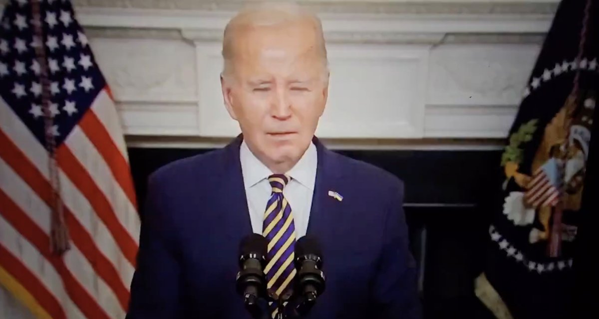 Joe Biden Wearing His Ukraine Flag. The World can see why 'Traitor Joe' Biden mostly wears dark sunglasses, even at night. Glad the Biden Administration Protects Ukraine's Borders while allowing millions of illegal aliens, terrorists, murderers, and rapists to invade America.