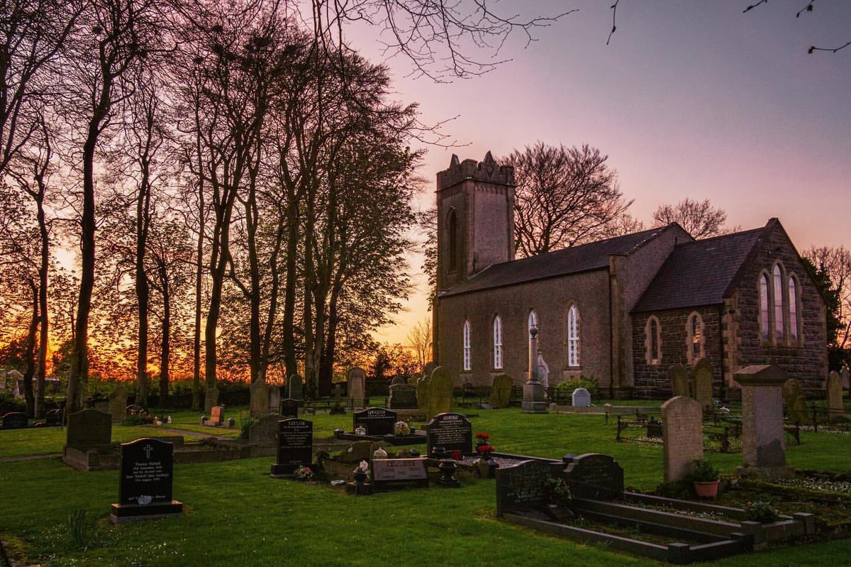 Sunset afterglow behind St. Patrick’s Church of Ireland, Ballyclug in Ballymena. 📸 John Fitz Photography • @johndfitz