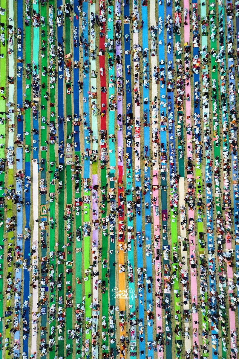 Humans in multicolored stripes during Eid prayers in Gaibandha, captured by Shazid Ahsan