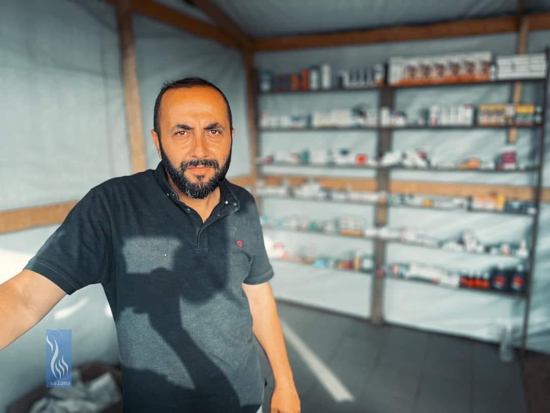 After Israel destroyed his two pharmacies in Shejaiya, Gaza City, Dr. Ahmed relocated to the displaced camps in Deir al-Balah. He then dedicated himself to building his own pharmacy inside a tent, providing a shelter for him and his family at night. Dr. Ahmed's determination to