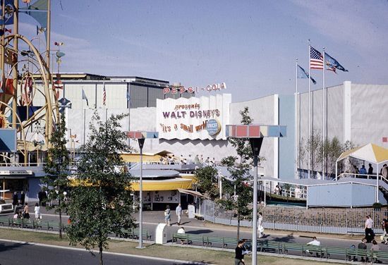 It’s a Small World as seen at the 1964/1965 New York World’s Fair. On the far left of the photo you can see part of Disney Legend Rolly Crump’s “Tower of the Four Winds”.