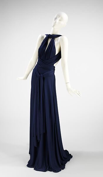 It was on this day in 1932 that the designer Roy Frowick Halston was born. His label, #Halston, became synonymous with #1970s glamour. Especially known for his bright colours, this is a different, all black affair, a halter neck swoosh of silk @metmuseum #fashionhistory