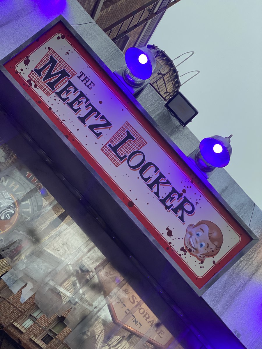 EvilTakesRoot's tweet photo. "Don’t know what it is, but we don’t care, we don’t know what it is, serve it up rare, don't know what it is, that gives it that zing! zing! So don’t bite too hard you might find a wedding ring!” #HHN31 #TheMeetzLocker #MeetzMeats #HHNOrlando #NeverGoAlone #StingAlley https://t.co/f0B84xyztH