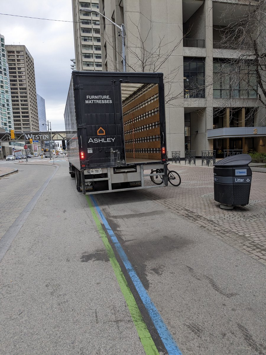 This giant furniture truck thought it would be cool to park for at least 15 minutes in the Queen's Quay path today. This led to other cars following suit, as always happens. This building at 3 QQ, has a whole loading area, but why bother? Ontario plate #BV79013 @AshleyHomeHelp