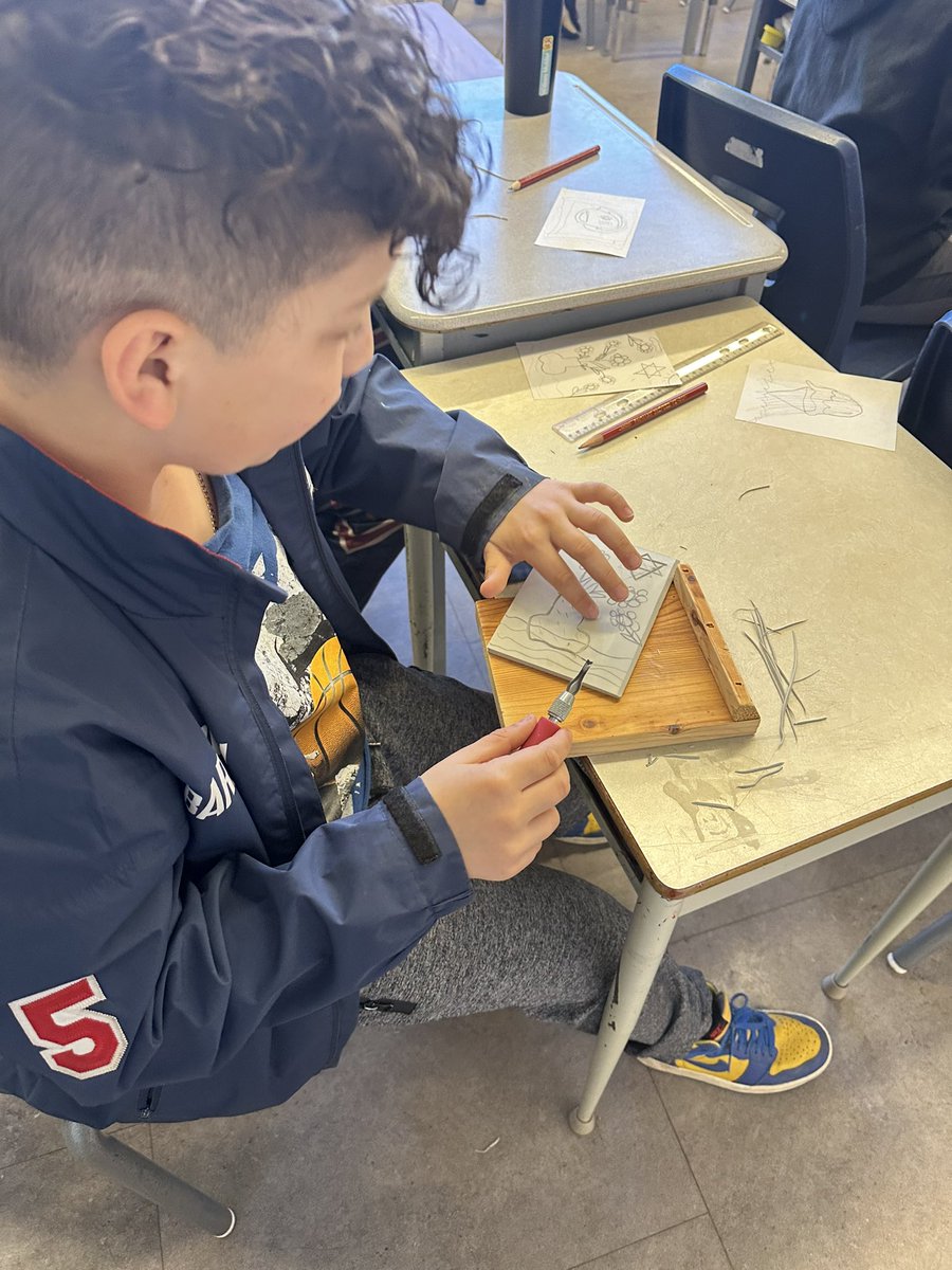 Our class participated in a lino-block printing making workshop this week. First steps were to sketch a design and transfer it onto the lino, then carve it out with special tools.