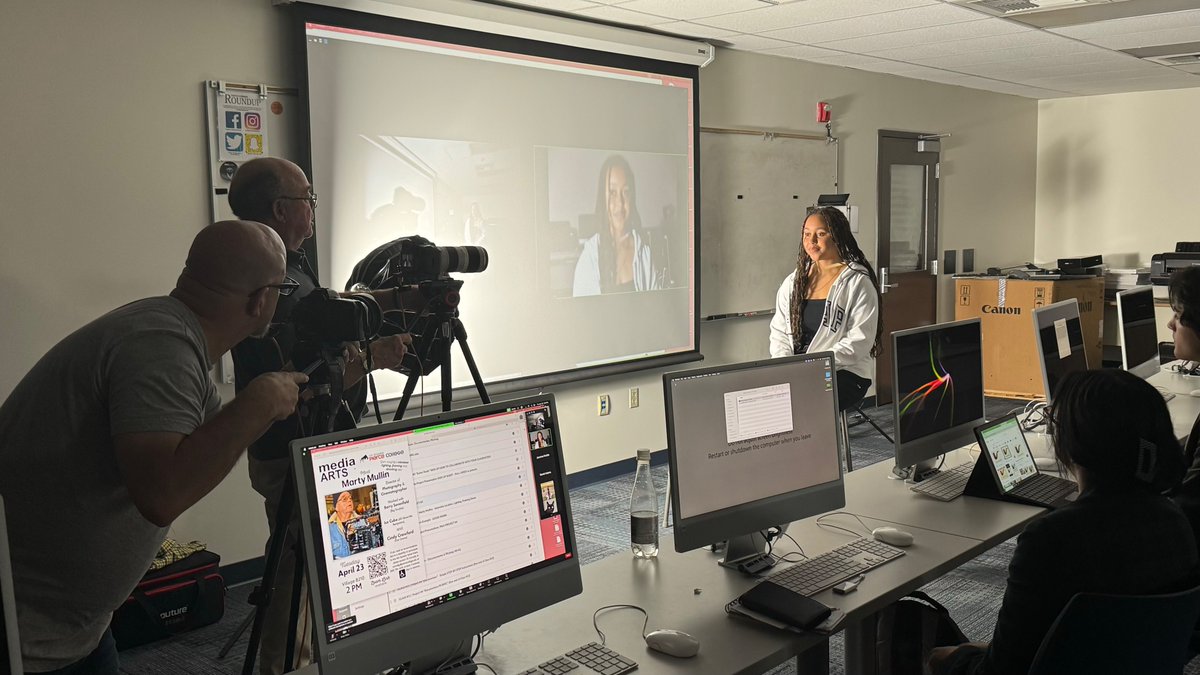 Professional cinematographer Marty Mullin explains and demonstrates proper interview framing, lighting and directing to Media Arts 101 (video production) student in the digital lab at Pierce College