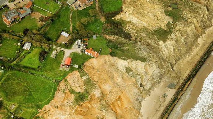 An 18th-century farmhouse in the United Kingdom is hanging off a cliff due to erosion on the coast. The farmhouse is located in Trimingham, England, and has been hanging off the cliff since the beginning of April after the land the house sits on eroded. The North Norfolk