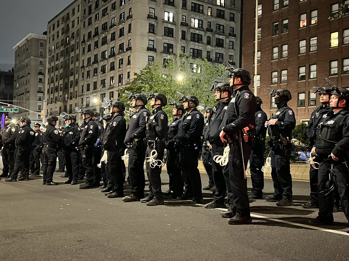 Dozens of these counterterrorism and strategic response officers and now lined up in front of the Columbia gates with zip ties