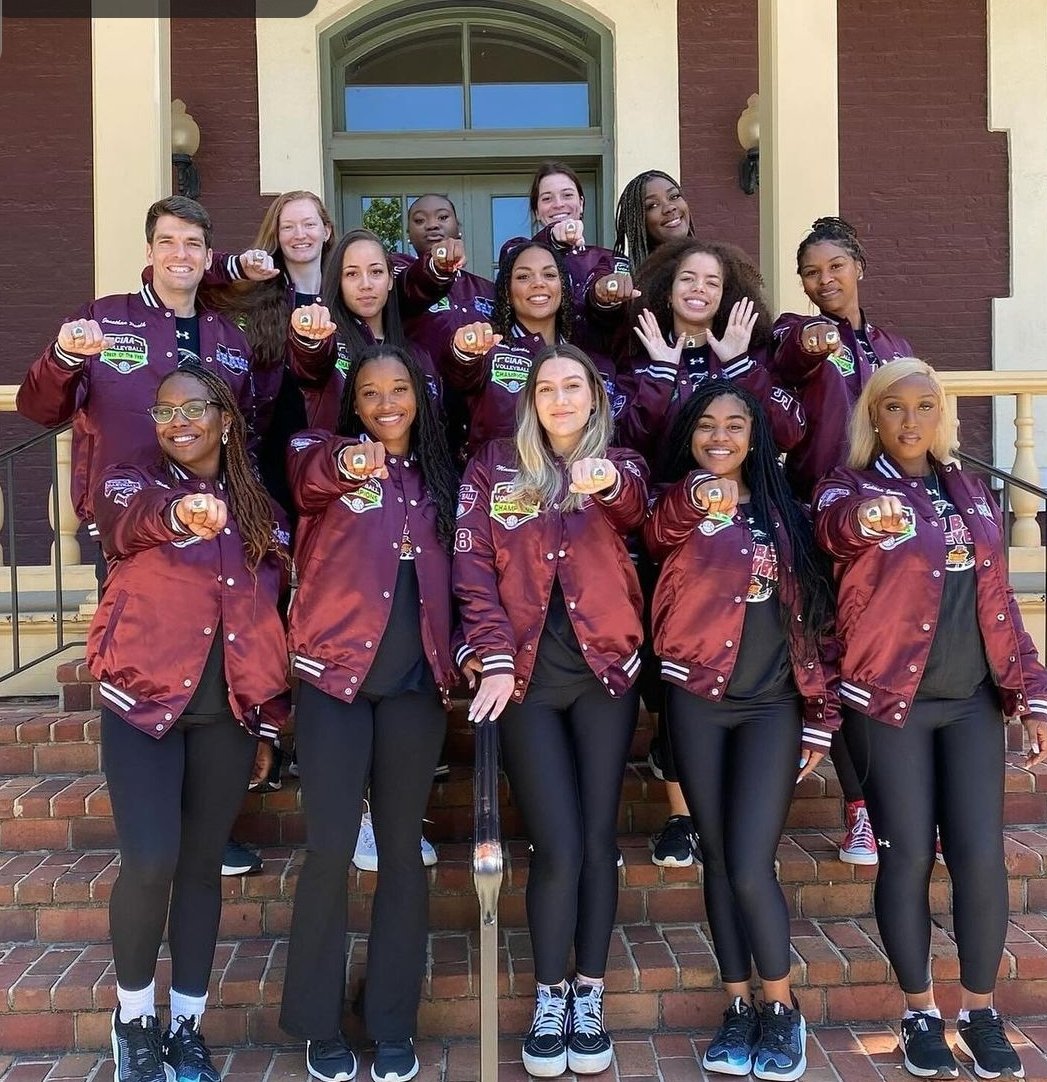 Shaw University Volleyball flexing their CIAA Championship Rings