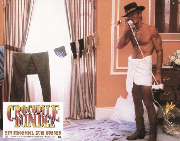 Crocodile Dundee was released #onthisday in 1986. This German lobby/ promo card for the film shows Mick Dundee doing his laundry in a New York hotel room - outback style. #NFSAOnline #CrocodileDundee #80s #PaulHogan