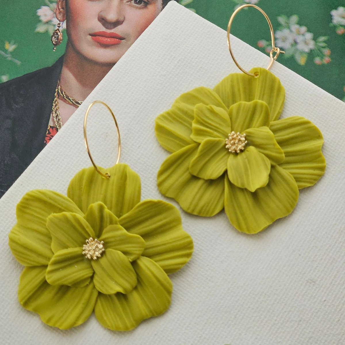 Loving these Frida Flowers in Chartreuse Green.  These would look fabulous in any outfit.  Made by #akaycollective with polymer clay and gold-filled hoops.  Also a great gift for those Frida lovers.  Visit akaycollective.com for more details.⁣
⁣
#polymerclayearrings