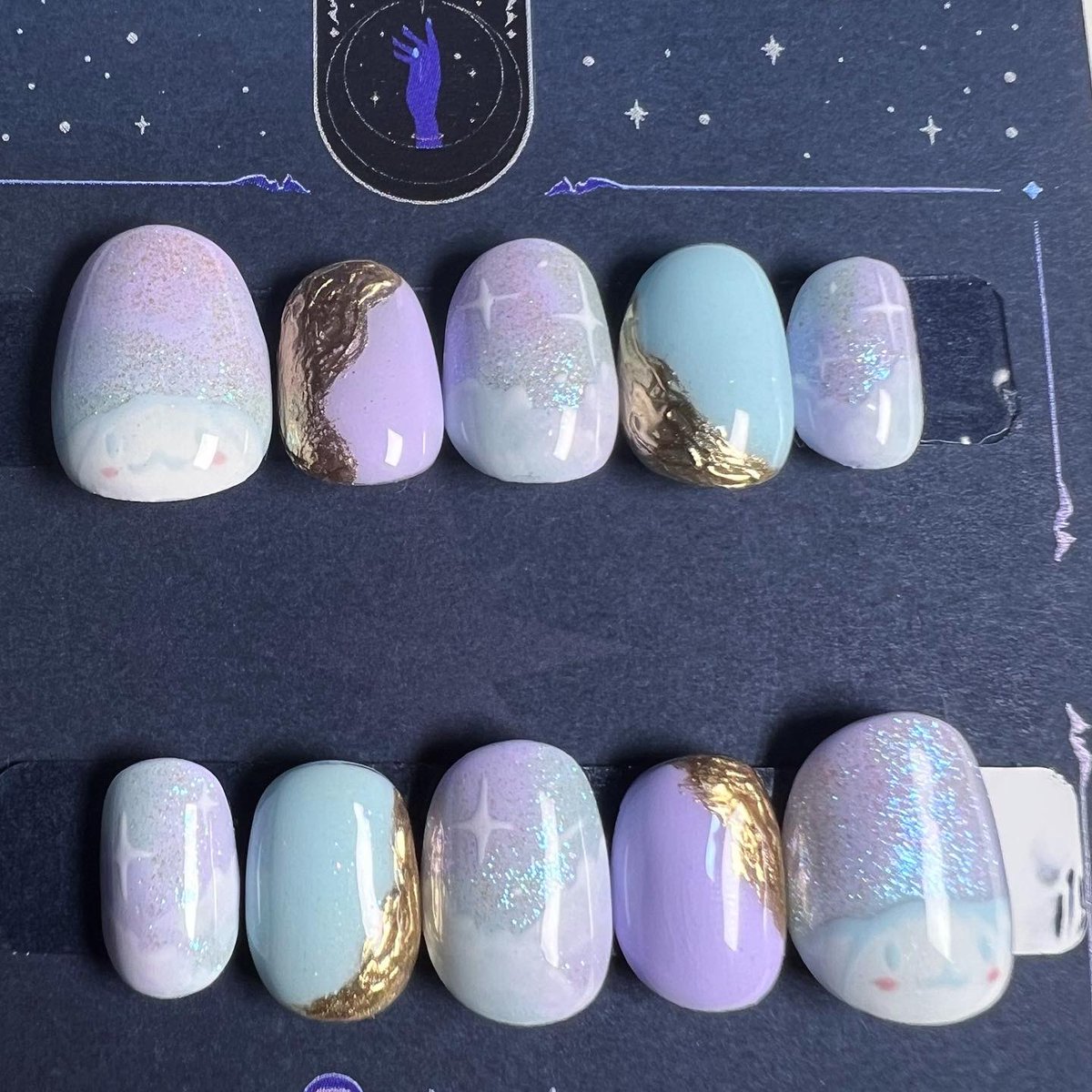 SidusNails's tweet photo. Commission of some dreamy Cinnamon Roll inspired press on nails~ ✨💫☁️
.
.
.
#nails #naildesign #nailart #cinnamonroll #pressonails https://t.co/Oap5opFA9T
