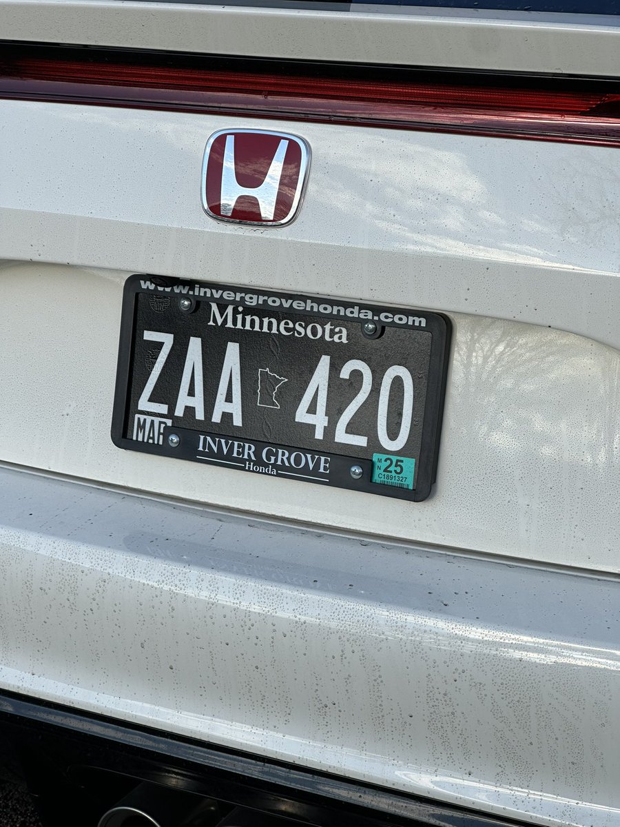 Absolutely outrageous license plate on this FL5. This is NOT a vanity/custom license plate. It’s literally just a randomized plate from the MN DMV. Insane.