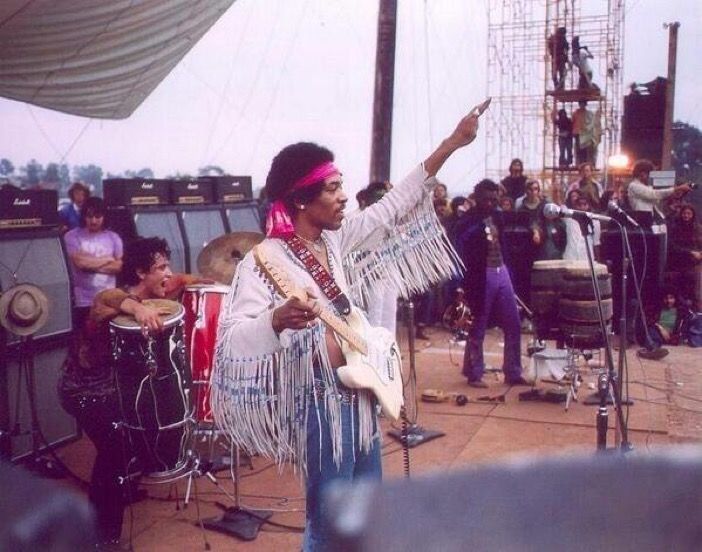 Jimi Hendrix on stage at Woodstock, 1969. Photo by Henry Diltz.
