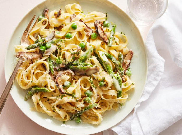 LopezKennethl14's tweet photo. Spring Vegetable Fettuccine Alfredo

highlights a delicious recipe that brings a fresh twist to the classic pasta dish. In this recipe, spring vegetables are used to brighten up the rich and creamy Alfredo sauce. Lemon zest and chives are added to cut through the richness of the dish, adding a burst of freshness. 

The recipe is easy to follow, with a total time of 30 minutes and active preparation time of 30 minutes, making it a quick and satisfying meal option. The yield of the recipe is 4 servings, making it perfect for a family dinner or a small gathering. 

To make the dish, you will need ingredients such as kosher salt, fresh fettuccine, shiitake mushrooms, asparagus, butter, frozen peas, black pepper, heavy cream, Parmigiano-Reggiano cheese, chives, and lemon zest. The use of fresh ingredients enhances the flavors of the dish and adds a vibrant touch to the creamy pasta. 

The cooking process involves boiling the pasta until al dente and reserving some pasta water before straining it. The mushrooms and asparagus are then sautéed in butter until tender and browned, adding a depth of flavor to the dish. The cream sauce is prepared by simmering butter and cream together before adding in the peas and Parmigiano-Reggiano cheese. 

Once the sauce is ready, the cooked vegetables, pasta, chives, and lemon zest are added and tossed together well. Seasoning with salt and pepper is essential to enhance the flavors of the dish. The pasta will thicken as it cools, but you can adjust the consistency by adding reserved pasta water gradually. 

A tip provided in the article is that heavy whipping cream contains stabilizers that help it stay at the desired consistency, making it ideal for thickening the Alfredo sauce. Additionally, you can use reserved pasta water to adjust the consistency of the sauce further. 

In conclusion, the "Spring Vegetable Fettuccine Alfredo" recipe offers a fresh and flavorful twist on the traditional pasta Alfredo, making it a perfect choice for a quick and delicious meal. The combination of spring vegetables, creamy sauce, and zesty lemon creates a delightful harmony of flavors that is sure to please your taste buds.