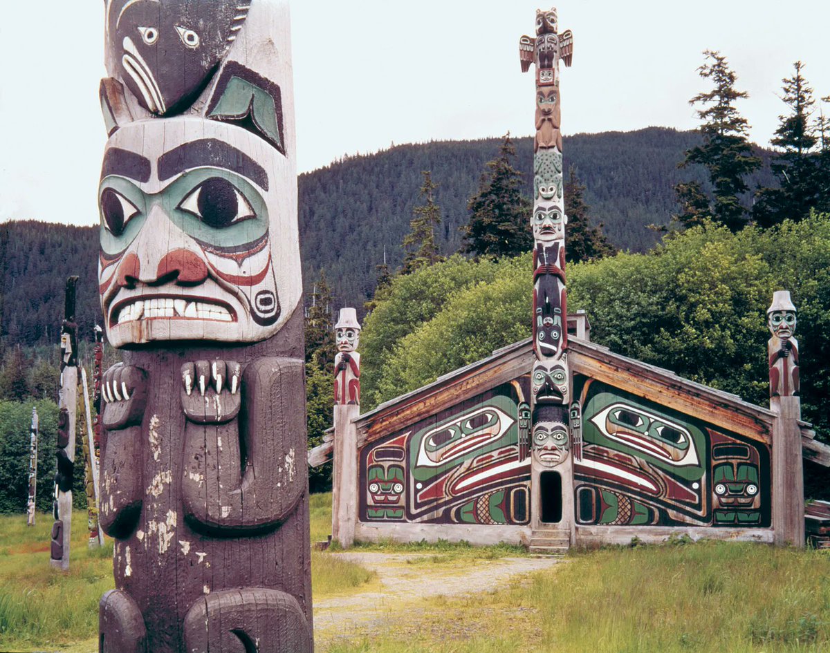 The Tlingit and Haida people of the northern coast of the PNW

They built totem poles, long houses of milled wood, and are amongst the most societally complex of NA indigenous peoples