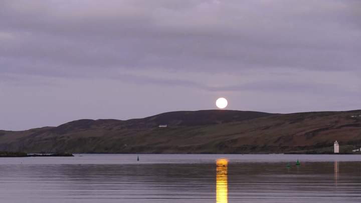 The pink moon setting over Port Ellen this morning.