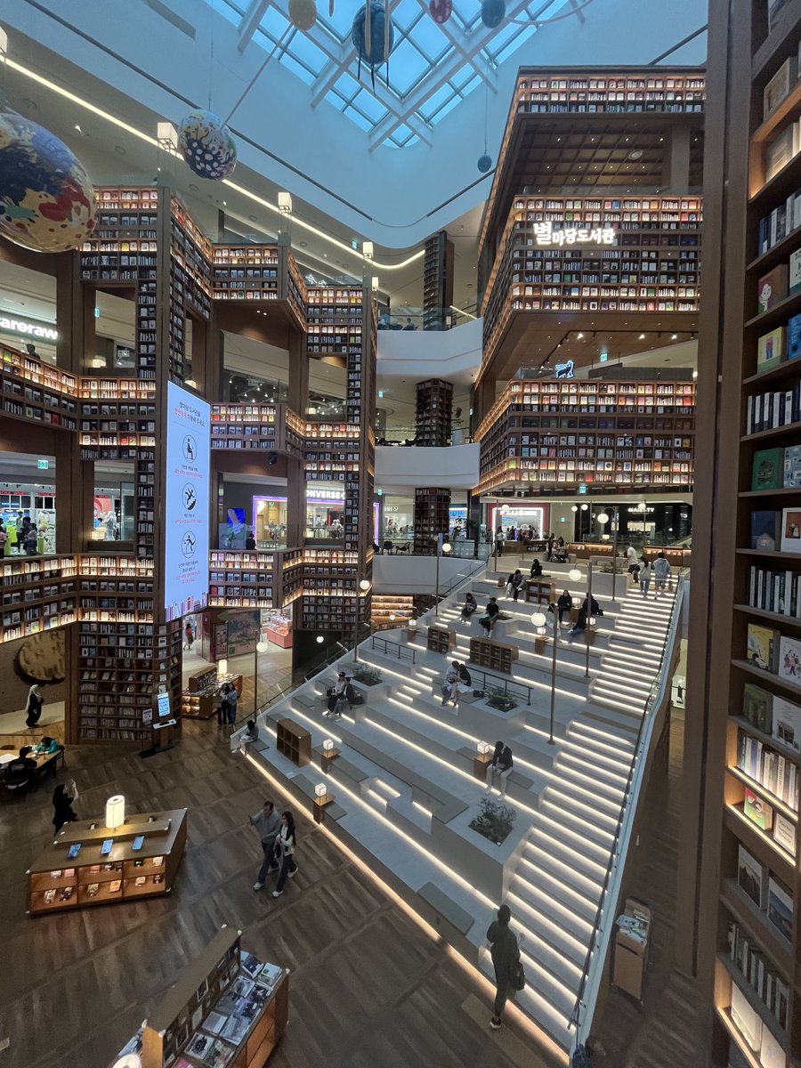 Four-storey library in a shopping mall, Suwon. You might need specialist climbing equipment to reach some of the books, but it looks great.