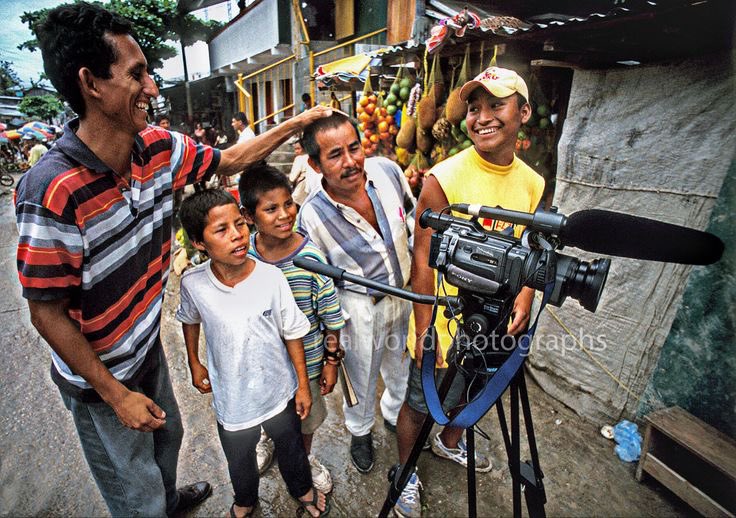 Curious locals checking out the video gear. Leticia, Colombia, South America. 2002. Gary Moore photo. #colombia #sony #southamerica #travel #photojournalism #realworldphotographs #garymoorephotography #stock #images #camera #leticia #border #malmo #sweden  @realworldphotographs