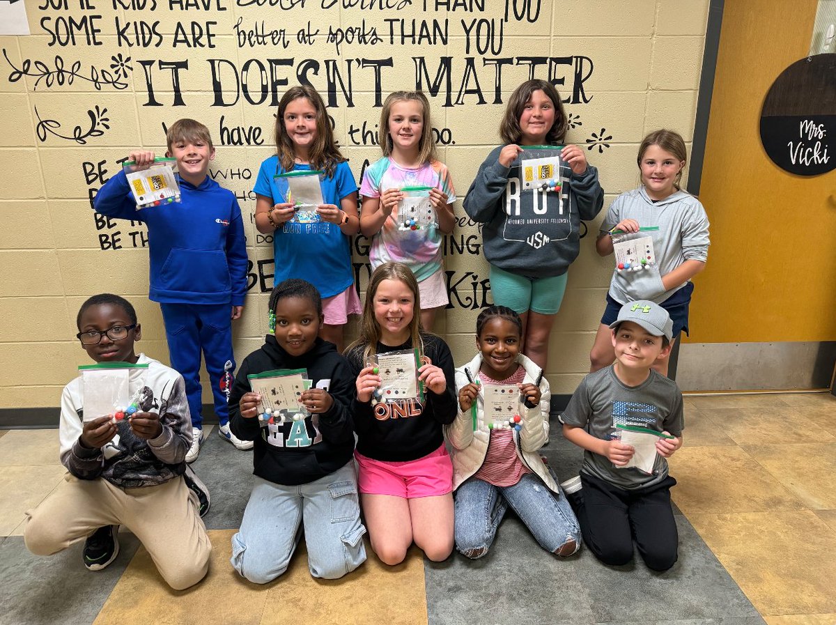 A group photo of the 3rd graders at LongLeaf Elementary School holding their 'magbag' takeaway magnetic molecular model kits! The kits were sponsored by the Center for STEM Education @usmSTEMed #STEMontheGO grant! #STEMeducation #realtimechem #chemtwitter #SMTTT