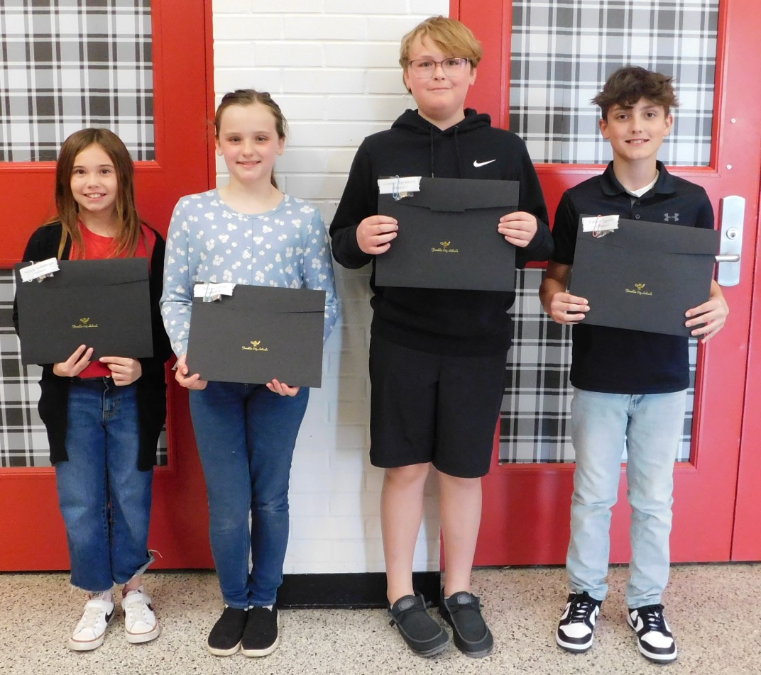 At their April 22 meeting, the Franklin Board of Education honored four students for earning 10 quarters of Straight A's: Carter Esposito and Cooper Turnmire (Hunter) and Natalie Wolfinbarger and Ariana Conde (Schenck).