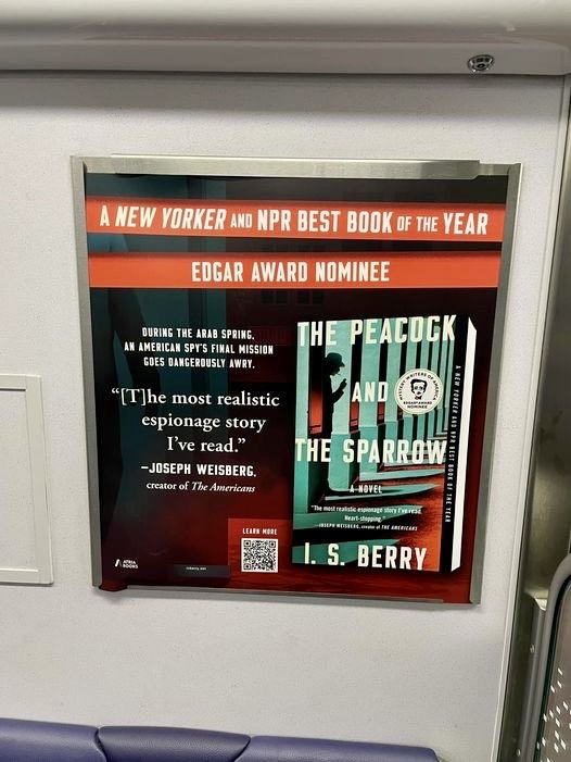 Spotted by a reader on the DC metro orange line. 🦚🚇 @wmata @AtriaMysteryBus @ITWDebutAuthors @AtriaBooks @simonschuster #dcmetro @OUTFRONTMEDIAUS #thepeacockandthesparrow