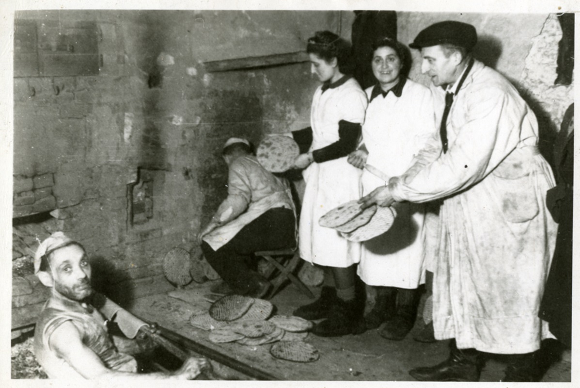 Men and women making matza for Passover. Lodz Ghetto, 1940. #fromtheyivoarchives #matza #matzo #matzah#passover #peysekh #pesach #jewishholiday
